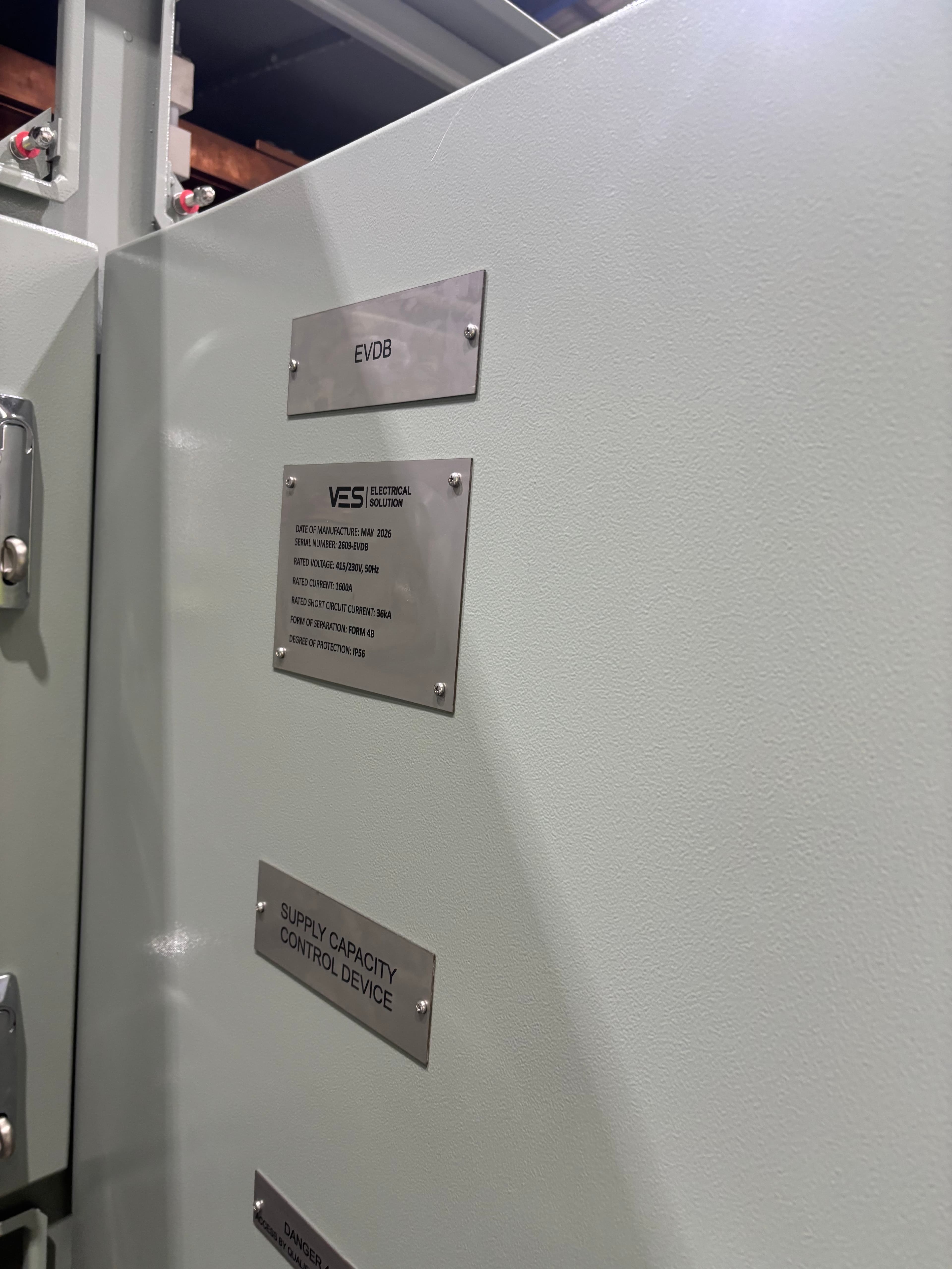 Stainless rating plates on switchboard door